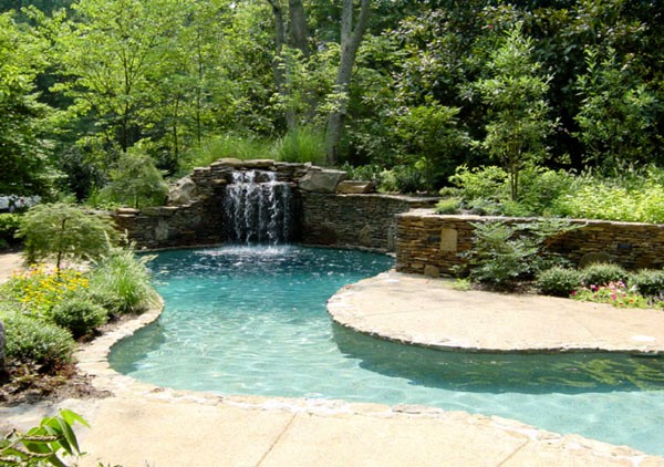 swimming pool with a small waterfall