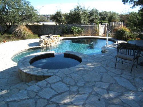 pool with a hot tub in the middle of the day